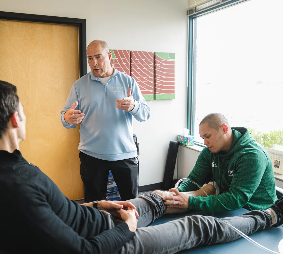 Dr. Tom Hecker and the Hecker Sports Medicine team treating a patient in Fort Collins